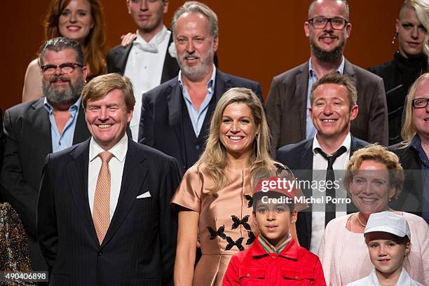 King Willem-Alexander of The Netherlands and Queen Maxima of The Netherlands pose with artists who participated in festivities marking the final...