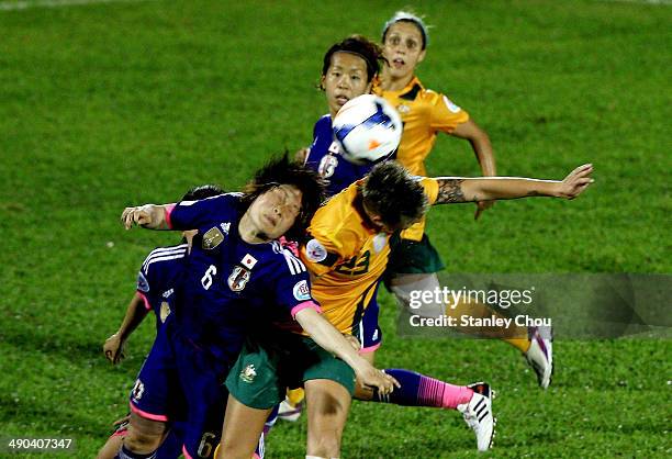Mizuho Sakaguchi of Japan clashes with Michelle Heyman of Australia during the AFC Women's Asian Cup Group A match between Australia and Japan at...