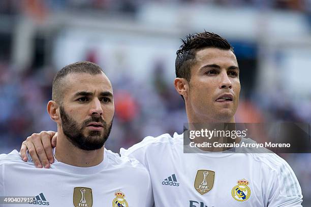 Karim Benzema of Real Madrid CF and his teammate Cristiano Ronaldo pose together at the line up prior to start the La Liga match between Real Madrid...