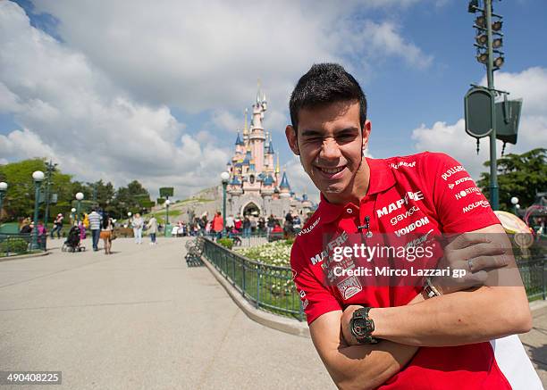 Jordi Torres of Spain and Mapfre Aspar Team Moto2 poses for photographers near the castle during the visit at Disneyland Paris on May 14, 2014 in...
