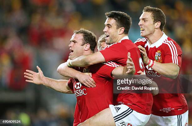 Jamie Roberts of the Lions is mobbed by team mates Conor Murray and George North after scoring the Lions fourth try during the International Test...