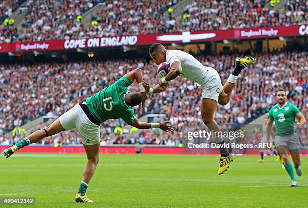 Anthony Watson of England takes the high ball over Simon Zebo of Ireland during the QBE International match between England and Ireland at Twickenham...