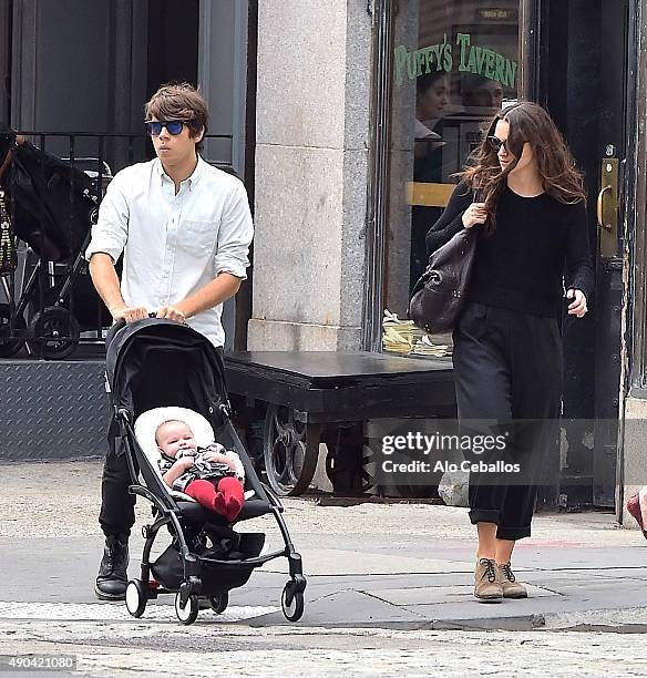 Actress Keira Knightley and her musician husband James Righton stroll with their baby Edie Righton in Soho on September 28, 2015 in New York City.