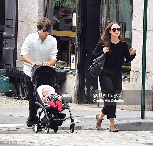 Actress Keira Knightley and her musician husband James Righton stroll with their baby Edie Righton in Soho on September 28, 2015 in New York City.