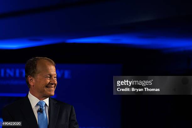 Cisco's Executive Chairman of the Board John Chambers is introduced to the crowd during the Clinton Global Initiative Annual Meeting at the Sheraton...