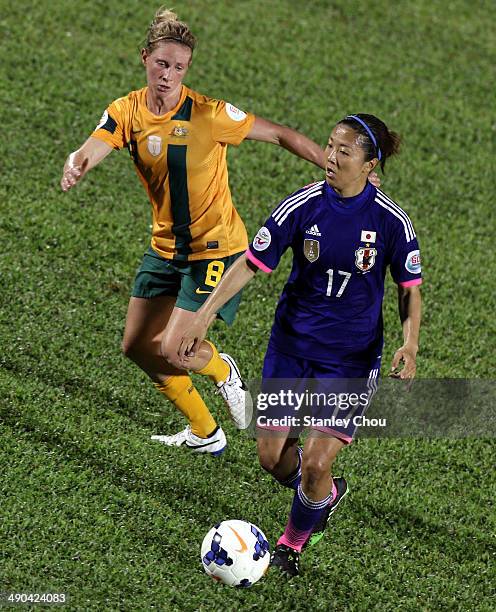 Yuki Ogimi of Japan is pursuit by Elise Kellond of Australia during the AFC Women's Asian Cup Group A match between Australia and Japan at Thong Nhat...