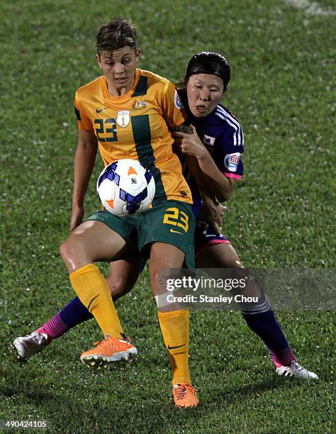 Samantha May Kerr of Australia battles with Yuri Kawamura of Japan during the AFC Women's Asian Cup Group A match between Australia and Japan at...
