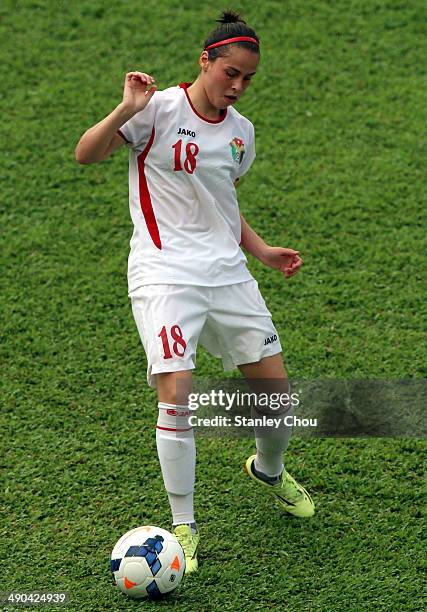 Hebah of Jordan passes the ball during the AFC Women's Asian Cup Group A match between Vietnam and Jordan at Thong Nhat Stadium on May 14, 2014 in Ho...
