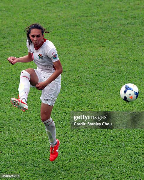 Aya Faisal of Jordan passes the ball during the AFC Women's Asian Cup Group A match between Vietnam and Jordan at Thong Nhat Stadium on May 14, 2014...