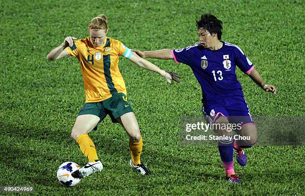 Clare Polkinghorne of Australia battles with Megumi Takase of Japan during the AFC Women's Asian Cup Group A match between Australia and Japan at...