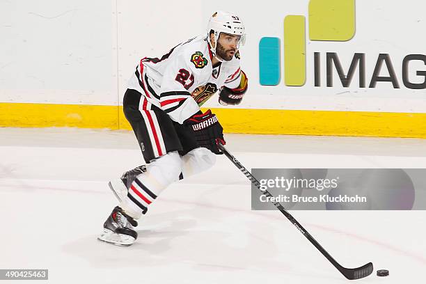 Johnny Oduya of the Chicago Blackhawks skates with the puck against the Minnesota Wild during Game Four of the Second Round of the 2014 Stanley Cup...