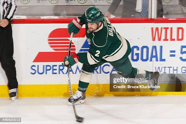 Keith Ballard of the Minnesota Wild passes the puck against the Chicago Blackhawks during Game Four of the Second Round of the 2014 Stanley Cup...