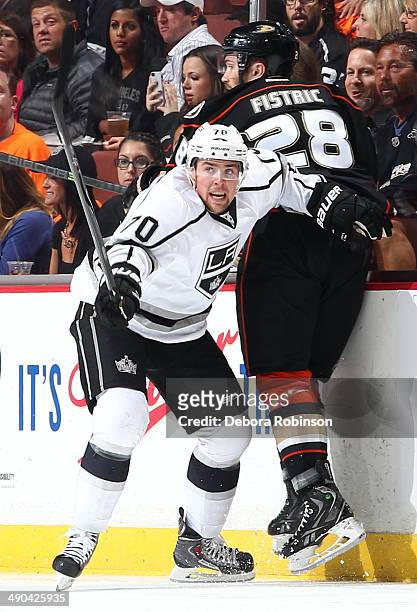 Tanner Pearson of the Los Angeles Kings battles for position against Mark Fistric of the Anaheim Ducks in Game One of the Second Round of the 2014...