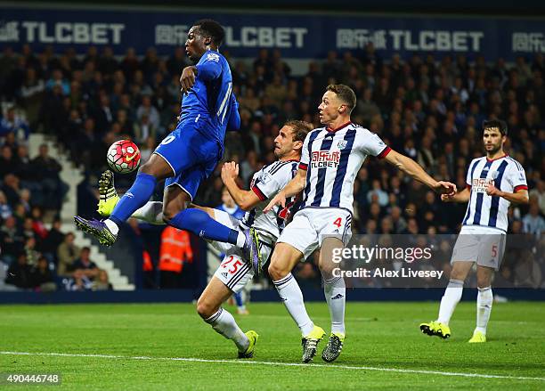 Romelu Lukaku of Everton beats Craig Dawson and James Chester of West Bromwich Albion as he scores their third goal during the Barclays Premier...