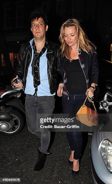 Kate Moss and Jamie Hince are seen on March 24, 2011 in London, United Kingdom.