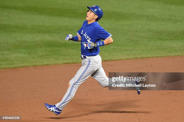 Munenori Kawasaki of the Toronto Blue Jays runs to second base in the fifth inning during a baseball game against the Baltimore Orioles at Oriole...