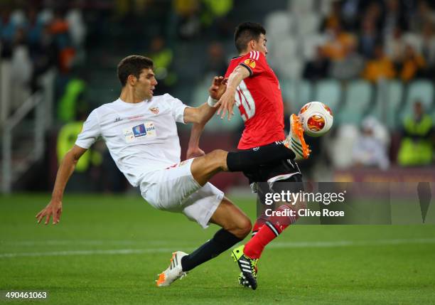 Federico Fazio of Sevilla tackles Nicolas Gaitan of Benfica in the area during the UEFA Europa League Final match between Sevilla FC and SL Benfica...