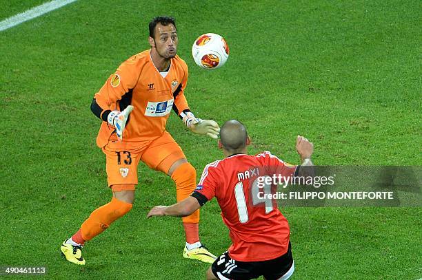 Benfica's Uruguayan defender Maxi Pereira tries to score against Sevilla's Portuguese goalkeeper Beto during the UEFA Europa league final football...