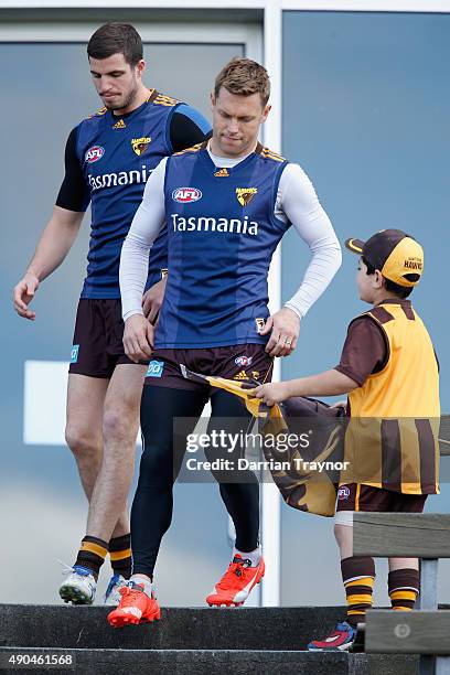 Sam Mitchell of the Hawks walks out to take part in a Hawthorn Hawks AFL training session at Waverley Park on September 29, 2015 in Melbourne,...