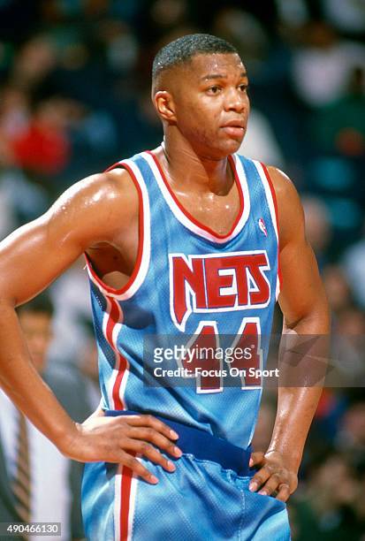 Derrick Coleman of the New Jersey Nets looks on against the Washington Bullets during an NBA basketball game circa 1991 at the Capital Centre in...