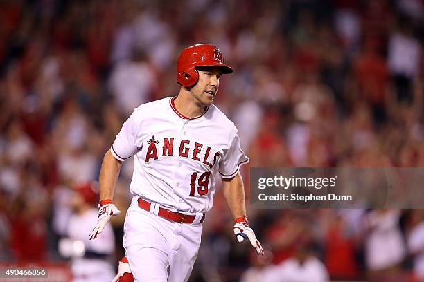 David Murphy of the Los Angeles Angels of Anaheim celebrates as he runs to first base on his walk off RBI single in the ninth inning against the...