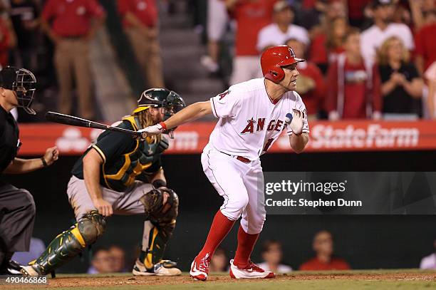 David Murphy of the Los Angeles Angels of Anaheim hits a walk off RBI single in the ninth inning against the Oakland Athletics at Angel Stadium of...