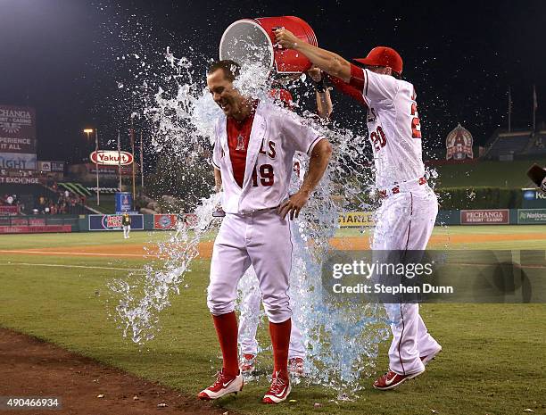 David Murphy of the Los Angeles Angels of Anaheim is doused by Matt Joyce and Taylor Featherston after his walk off RBI single in the ninth inning...