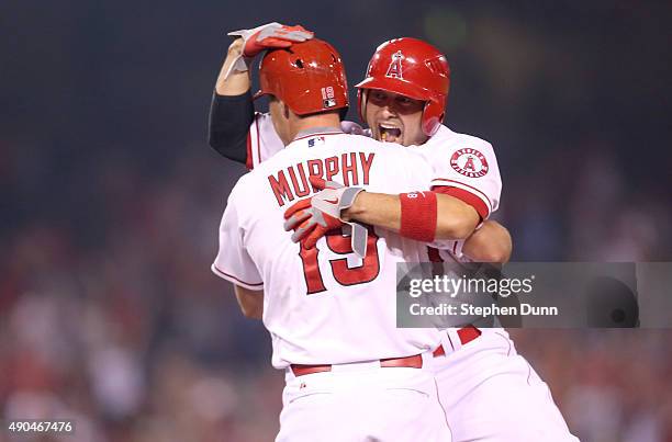 David Murphy of the Los Angeles Angels of Anaheim celebrates with Shane Victorino after his walk off RBI single in the ninth inning against the...