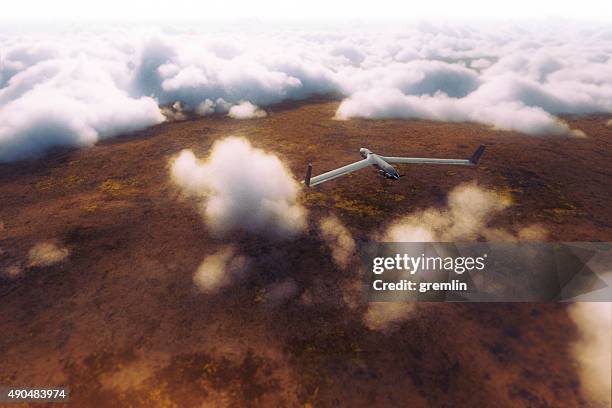 uav on the mission above the clouds - unmanned aerial vehicle stock pictures, royalty-free photos & images