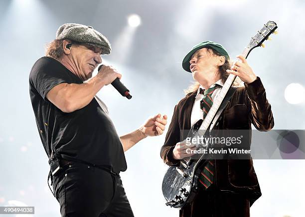 Singer Brian Johnson and musician Angus Young of AC/DC perform at Dodger Stadium on September 28, 2015 in Los Angeles, California.