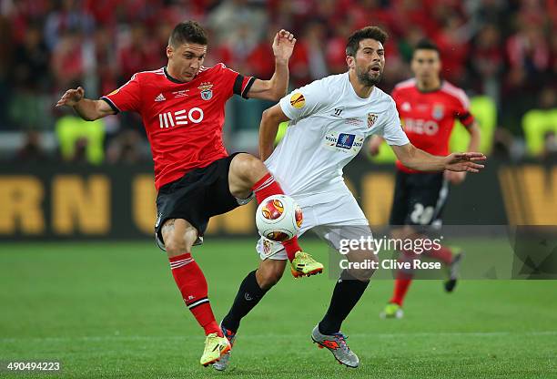 Guilherme Siqueira of Benfica clashes with Coke of Sevilla during the UEFA Europa League Final match between Sevilla FC and SL Benfica at Juventus...