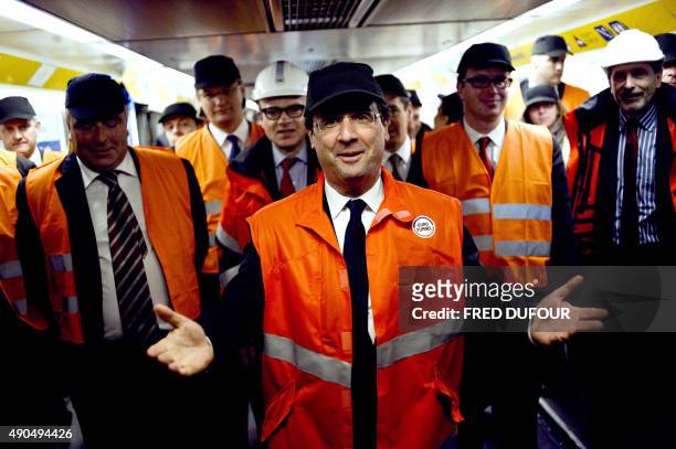 France's opposition Socialist Party candidate for the 2012 French presidential election Francois Hollande , flanked by Boulogne-sur-Mer's mayor and...