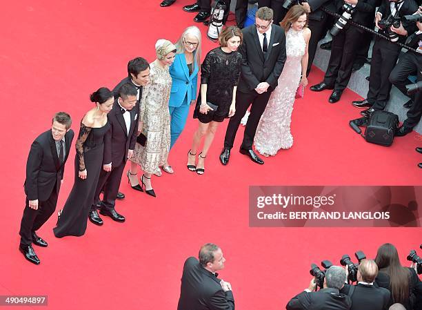 New Zealander director and President of the Feature films Jury Jane Campion poses with the members of the Feature films Jury US actor Willem Dafoe,...