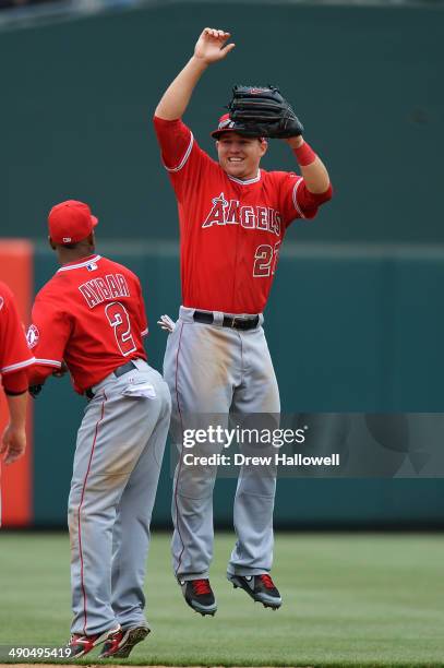 Mike Trout and Erick Aybar of the Los Angeles Angels celebrate a 3-0 win over the Philadelphia Phillies at Citizens Bank Park on May 14, 2014 in...