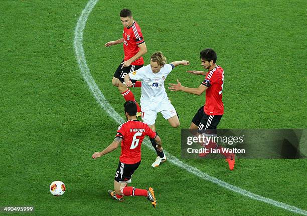 Ivan Rakitic of Sevilla is closed down by Ruben Amorim, Andre Gomes and Guilherme Siqueira of Benfica during the UEFA Europa League Final match...