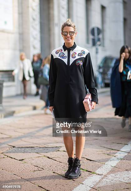 Fashion blogger Helena Bordon wears MSGM dress, Elena Ghisellini bag & Chanel shoes during Milan Fashion Week Spring/Summer 16 on September 27, 2015...