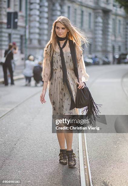Maria Kolosova wears Galina Podzolko dress & Barbara Bonner bag during Milan Fashion Week Spring/Summer 16 on September 26, 2015 in Milan, Italy.