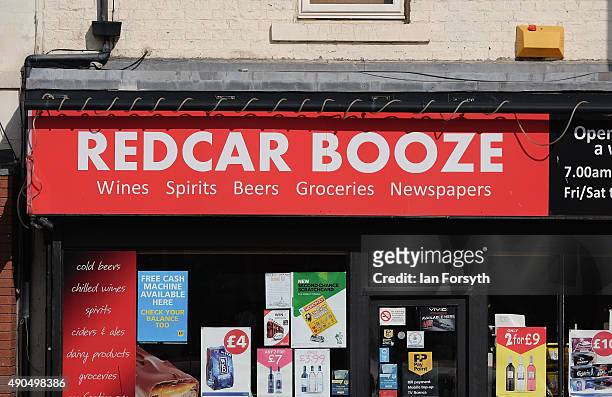 An off licence shop displays posters advertising drinks on September 29, 2015 in Redcar, England. Following the announcement by SSI UK that the steel...