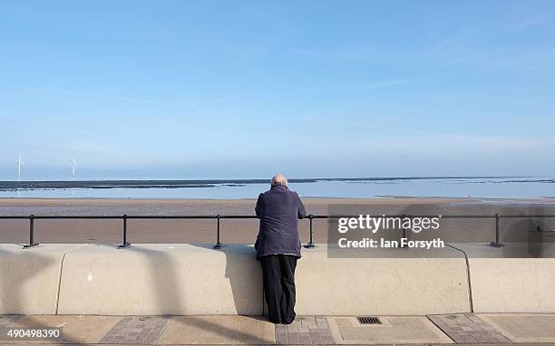 Man leans against a wall on Redcar seafront as he looks out to sea on September 29, 2015 in Redcar, England. Following the announcement by SSI UK...