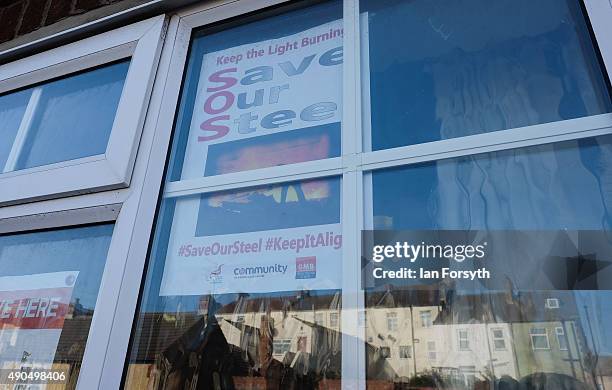 Save our Steel poster is displayed in the window of a workingmen's Club on September 29, 2015 in Redcar, England. Following the announcement by SSI...