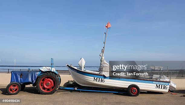 Tractor and fishing boat are parked on the seafront on September 29, 2015 in Redcar, England. Following the announcement by SSI UK that the steel...