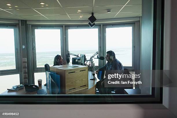 Presenter speaks with a guest at the recently launched Zetland FM radio station in Redcar Beacon on September 29, 2015 in Redcar, England. Following...