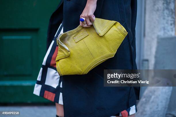 Guest holds a clutch during Milan Fashion Week Spring/Summer 16 on September 27, 2015 in Milan, Italy.