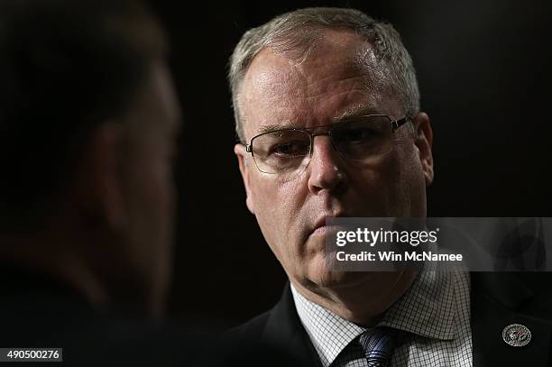 Deputy Defense Secretary Robert Work speaks with colleagues prior to testifying before the Senate Armed Services Committee September 29, 2015 in...