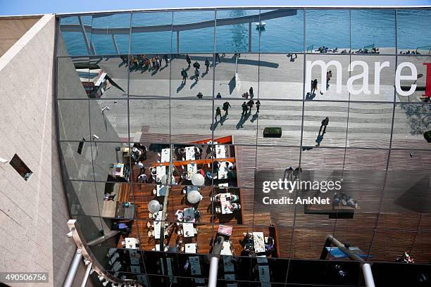 outdoor dining at mare magnum in barcelona, spain - magnum cafe stock pictures, royalty-free photos & images