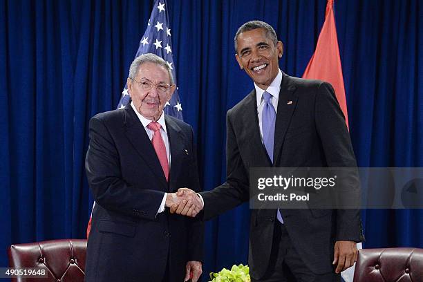 President Barack Obama and President Raul Castro of Cuba shake hands during a bilateral meeting at the United Nations Headquarters on September 29,...