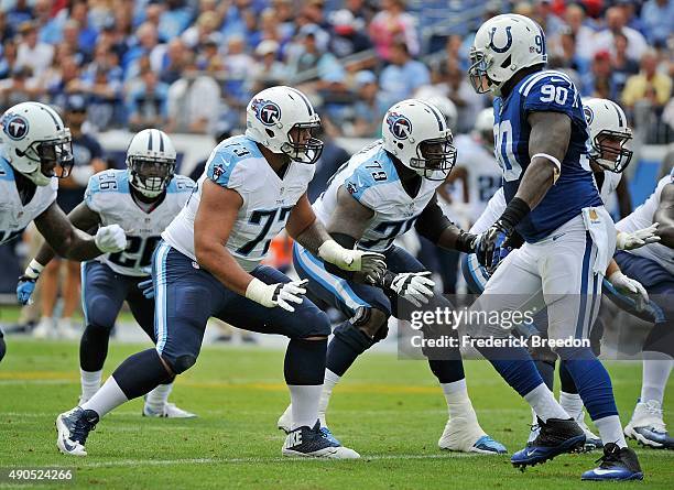 Jeremiah Poutasi of the Tennessee Titans blocks against the Indianapolis Colts at Nissan Stadium on September 27, 2015 in Nashville, Tennessee.