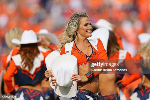 The Denver Broncos cheerleaders performs during a break in the action against the Baltimore Ravens at Sports Authority Field at Mile High on...