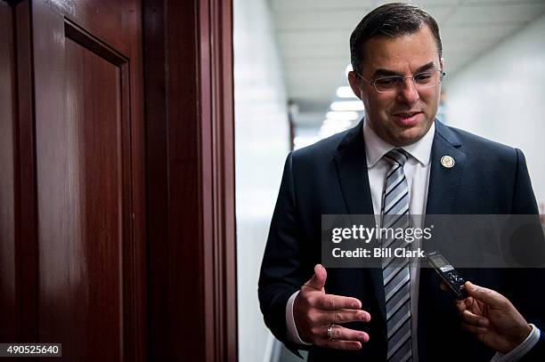 Rep. Justin Amash, R-Mich., speaks with a reporter outside of the House Republican Conference meeting in the basement of the U.S. Capitol on Tuesday,...