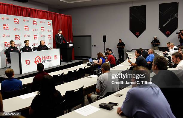 Gene Haas, owner of Haas F1 Team, speaks with the media as Romain Grosjean of France, Gunther Steiner, team principal of Haas F1 Team, and Mike...